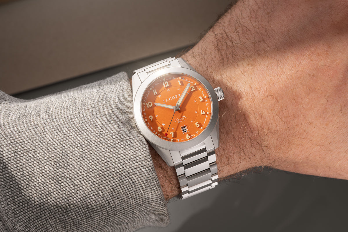 Field One Orange worn on the wrist