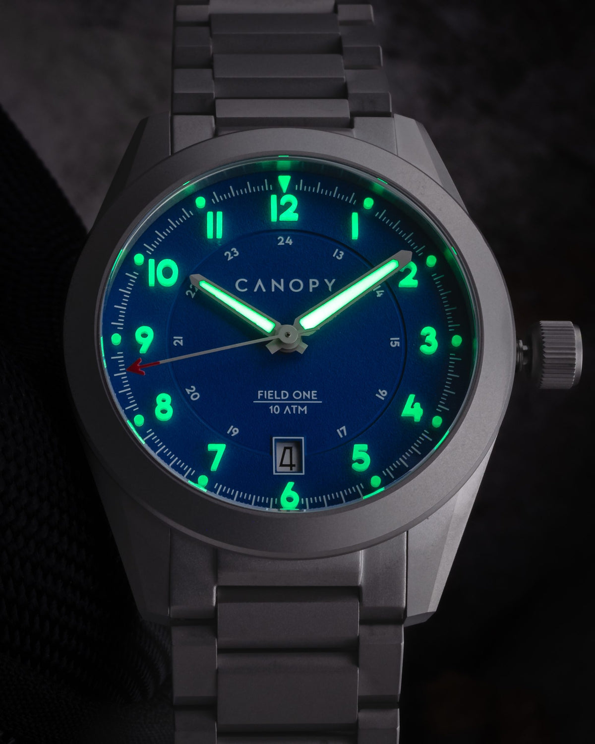 Field One Blue with illuminated green numerals, indices and hands